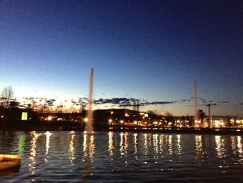 Reflection of illuminated buildings in water