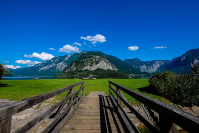 Scenic view of field against cloudy sky