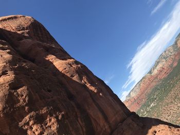 Low angle view of rock formation against sky