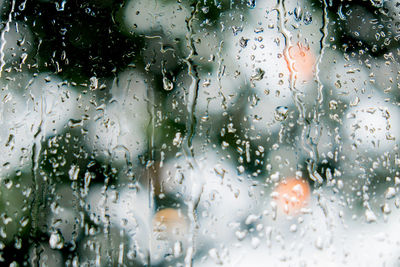 Full frame shot of wet window in rainy season