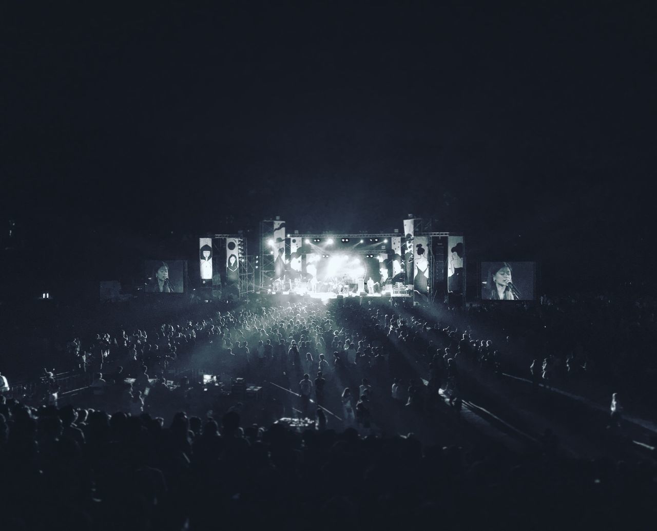 large group of people, night, illuminated, crowd, person, men, lifestyles, event, leisure activity, arts culture and entertainment, music, concert, city, light - natural phenomenon, silhouette, sky, performance, togetherness