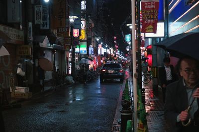 Cars on road in city at night