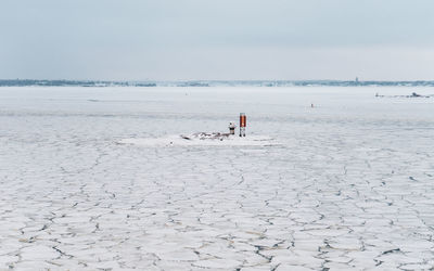 Scenic view of frozen sea against sky