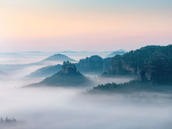 Winterstein also called hinteres raubschloss in mist. it is rock butte with rest of stronghold ruin