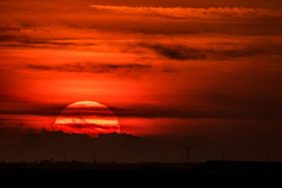 Scenic view of silhouette landscape against romantic sky at sunset