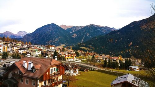 High angle view of townscape and mountains against sky