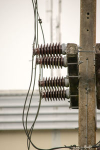 Close-up of metallic structure against wall