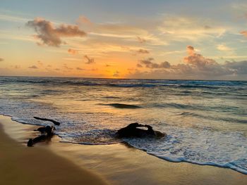 Scenic view of sea against sky during sunset