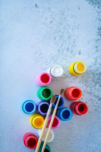 High angle view of multi colored candies in container