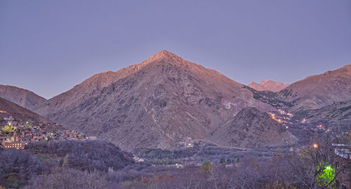 Scenic view of mountains against clear blue sky