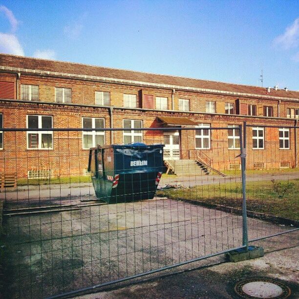 architecture, building exterior, built structure, window, building, transportation, residential building, residential structure, house, street, clear sky, day, old, sky, land vehicle, sunlight, no people, outdoors, abandoned, wall - building feature