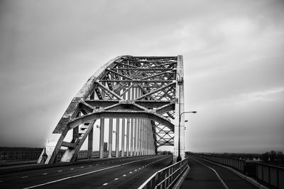 Low angle view of  waalbrug nijmegen bridge against sky