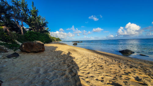 Scenic view of beach against sky