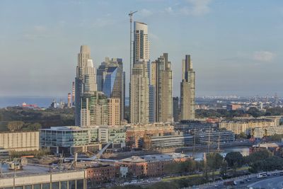 Modern buildings in city against sky