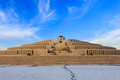 Low angle view of historical building against blue sky