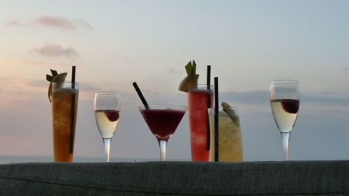 Close-up of cocktails against sky
