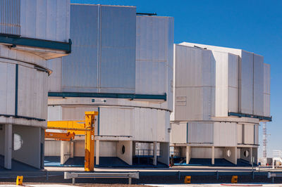 Low angle view of building against clear blue sky