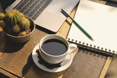 High angle view of coffee cup on table