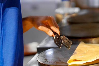 Close-up of man preparing food