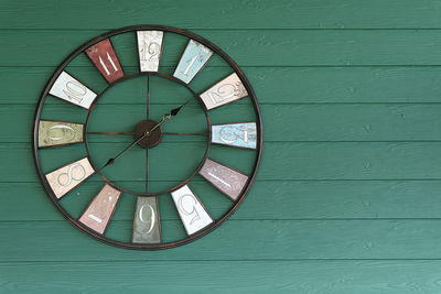 Close-up of clock on wall