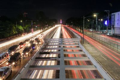 High angle view of light trails on road at night