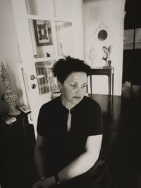 Portrait of young man looking at home