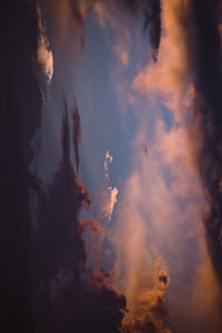 Low angle view of dramatic sky during sunset