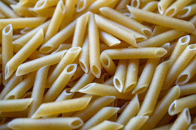 Uncooked macaronni pasta background, italian food