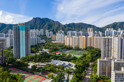 High angle view of buildings in city against sky