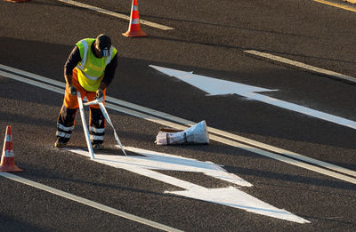 Shadow of man on road