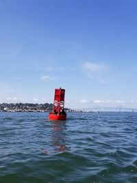 Nautical vessel on sea against sky