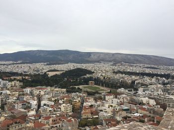 Aerial view of cityscape against sky