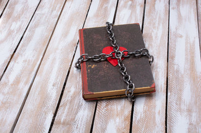 Close-up of key on wooden floor