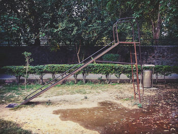 Empty playground in forest