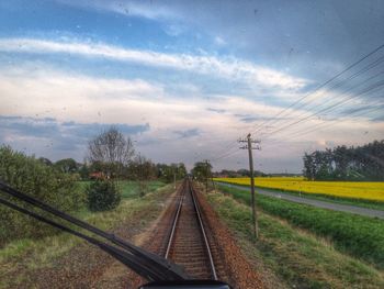 Train on railroad track against sky