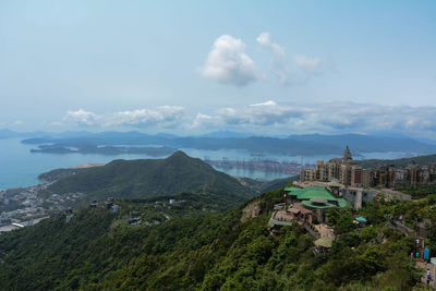 Scenic view of mountains and sea against sky