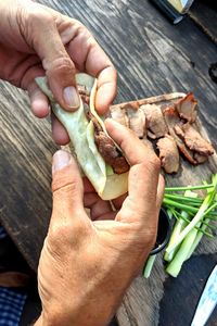 High angle view of man preparing food on table