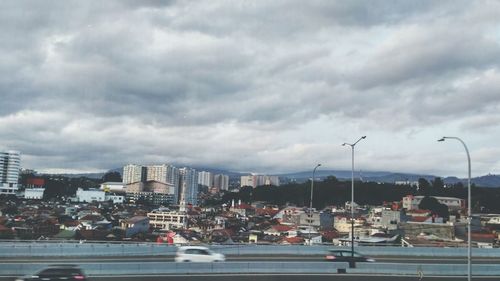 View of city against cloudy sky