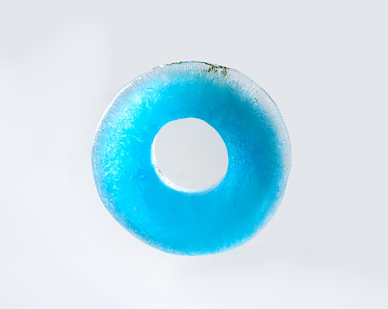 CLOSE-UP OF BLUE BALL AGAINST WHITE BACKGROUND