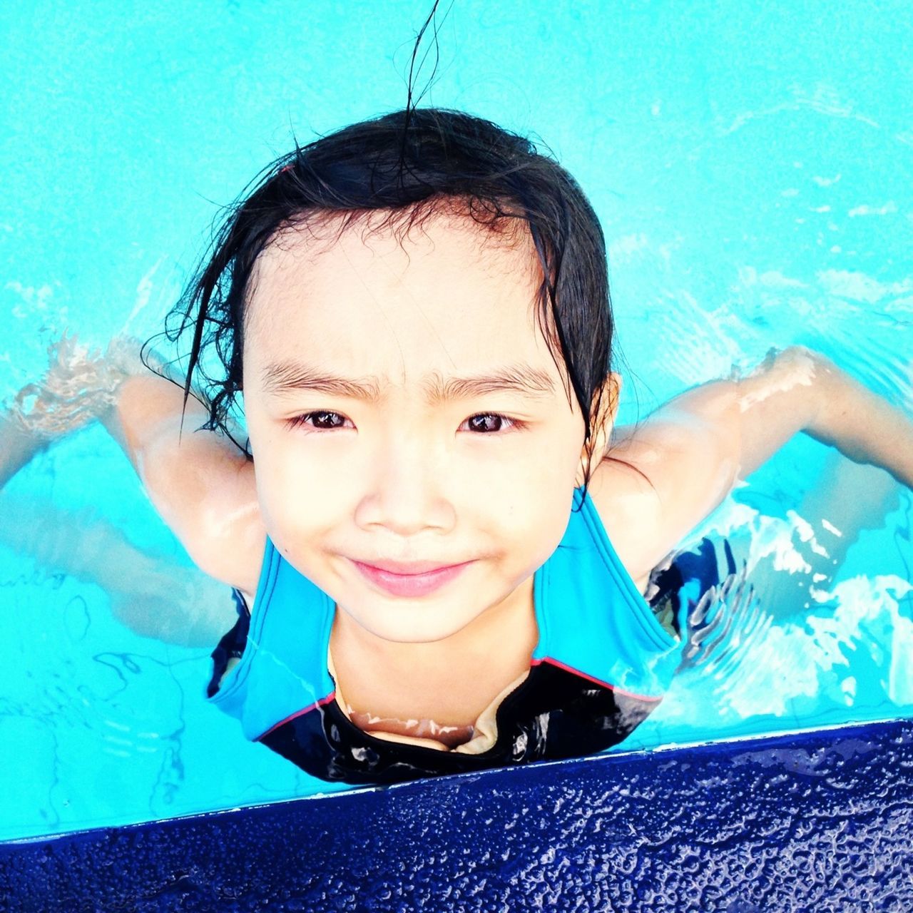 looking at camera, person, portrait, lifestyles, leisure activity, childhood, front view, headshot, water, blue, elementary age, smiling, happiness, cute, casual clothing, boys, young adult, swimming pool