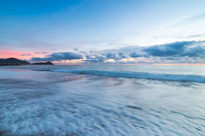 Scenic view of sea against sky at sunset