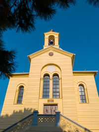 Low angle view of building against blue sky