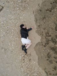 High angle view of man standing on beach