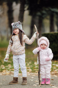 Portrait of cute girl standing outdoors