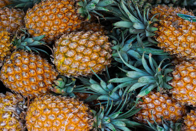 Close-up of pineapple fruits for sale in market