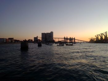 Scenic view of sea against clear sky during sunset