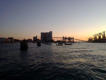 Scenic view of sea against clear sky during sunset