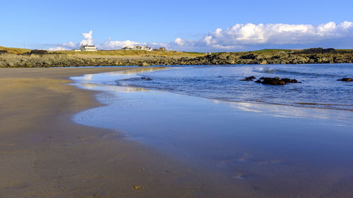 Scenic view of beach against sky