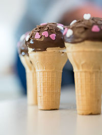 Close-up of ice cream cones on table