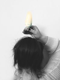 Close-up of woman over white background